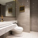 Bright layered lighting setup in a contemporary residential bathroom, showcasing professional lighting installation services by Dustmen Electric.