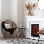 An electric fireplace insert warming a home, highlighting essential fireplace heater safety tips provided by Dustmen Electric.