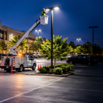 Dustmen Electric, LLC service truck parked outside a residential home for electrical maintenance.