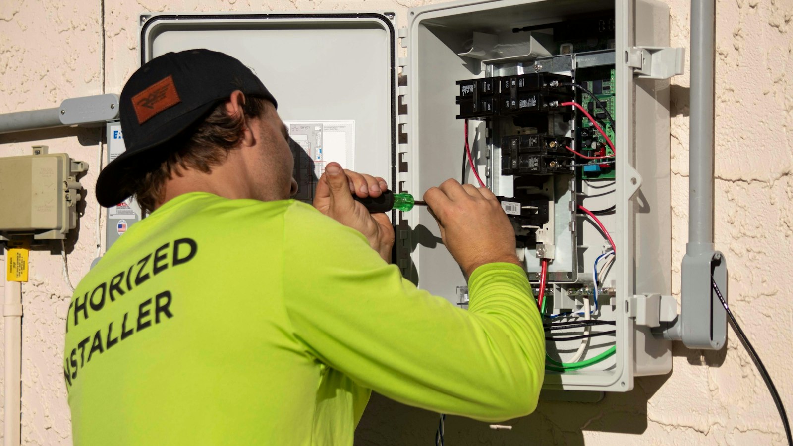 Licensed electrician evaluating a residential electrical panel